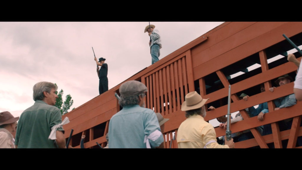 Reeenactors in the film Bisbee 17; men loading other men into a cattle car